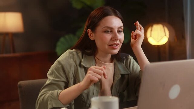 Focused young woman waiting for important message and get notification and celebrate online win success reading great news message feel amazed happy at home workplace