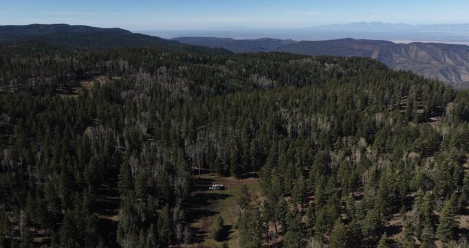 Aerial of RV camped in Lincoln National Forest in Cloudcroft New Mexico on sunny spring day
