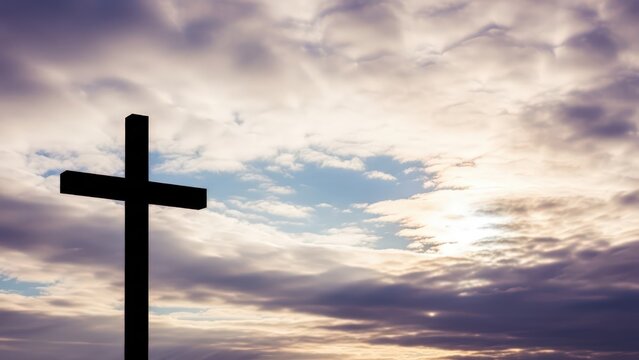 Silhouette of a cross against a cloudy sky