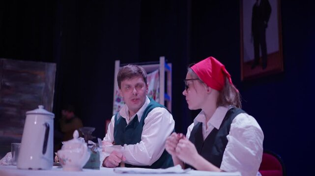 School theatre performance with students in costume acting on stage under dramatic lighting, capturing rehearsal moments and emotional expression during a play
