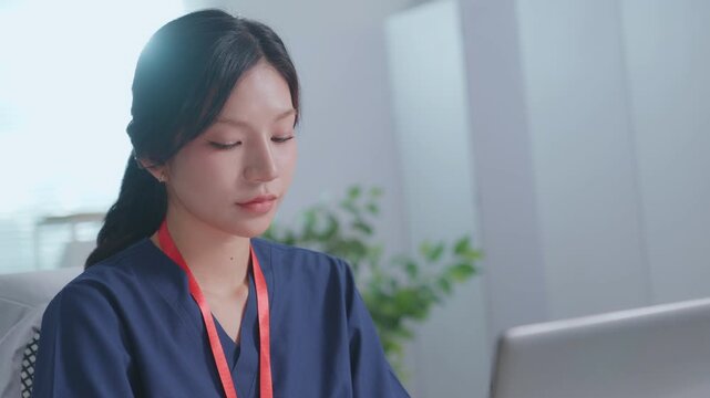 Doctor entering electronic medical records. Medical, asian woman working with computer in  medical consultation at hospital. which are recording diagnoses and patient symptoms.