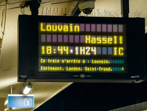 23 March 2026, Brussels, Belgium. Close-up of train departure board showing delay to Hasselt at Brussels-North station