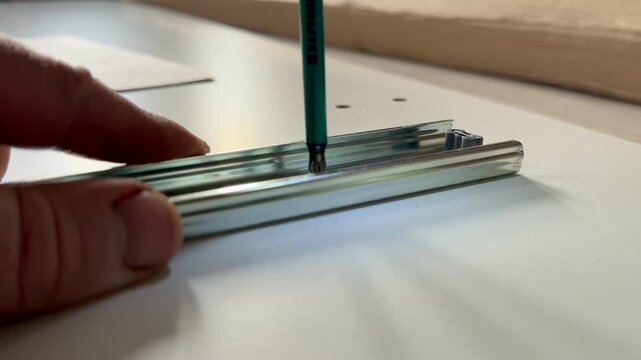 Drilling Screws while driving into wooden material. Construction industry. Cordless combi drill for used as drill and screw driver. Screwdriver for work with self-tapping screws in furniture workshop.