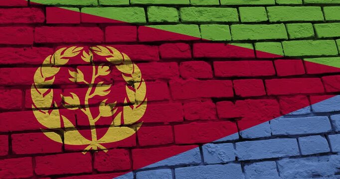 A panning video of a brick wall with the eritrea flag