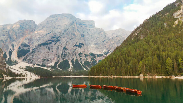 Traditional wooden boats floating on braies lake dolomites