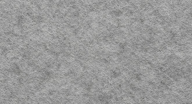 Flat lay texture of grey felt fabric showing a dense, non-woven fibrous surface.