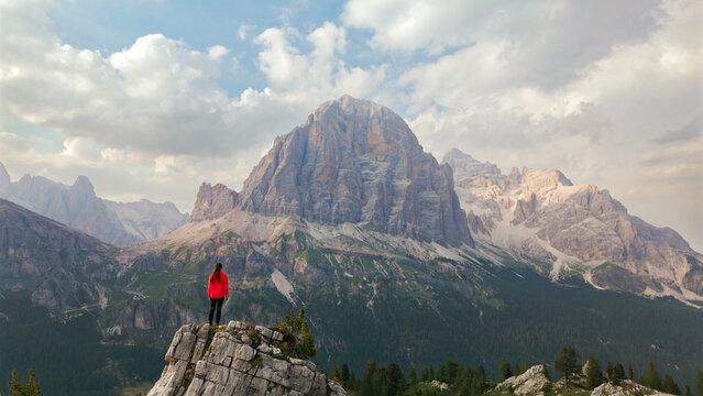 Woman enjoying scenic mountain view in dolomites