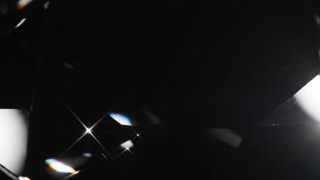 A close up view of a black diamond with shiny sparkle