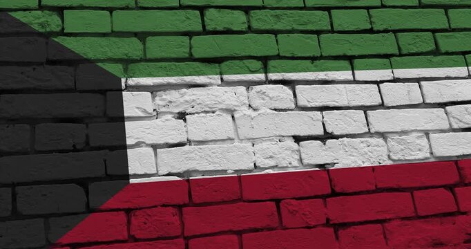 A panning video of a brick wall with the kuwait flag