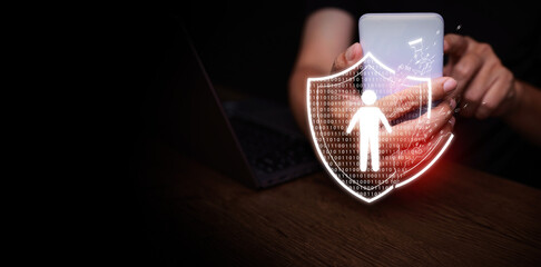 Personal data breach and cybersecurity concept. Broken shield protecting human figure is attacked, held by a man using smartphone. Identity theft protection, web scam, information leak, or mobile hack © OleCNX