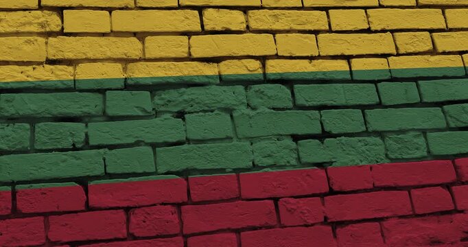 A panning video of a brick wall with the lithuania flag