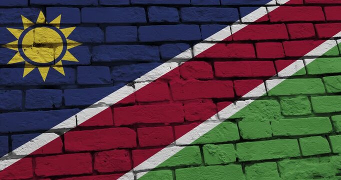 A panning video of a brick wall with the namibia flag