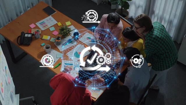 A diverse team collaborates in a modern office, utilizing digital tools and visual data to enhance creativity and strategy in project development. Raster