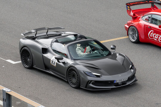 Stavelot, Belgium - April 5th 2026 : View on a matte grey Ferrari 296 GTS Novitec N-Largo finished in Grigio Silverstone Opaco driving on a street.