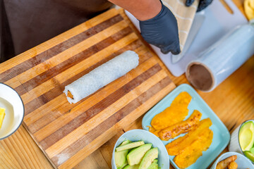 Preparing peruvian nikkei fusion maki sushi roll © Guillermo Spelucin