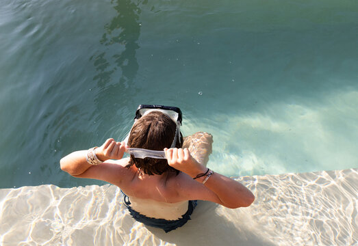 10 year old boy at poolside, Vilankulos, Mozambique, Africa