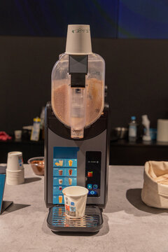Beverage dispenser machine with cups on counter