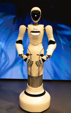 Humanoid robot standing with hands open for interaction
