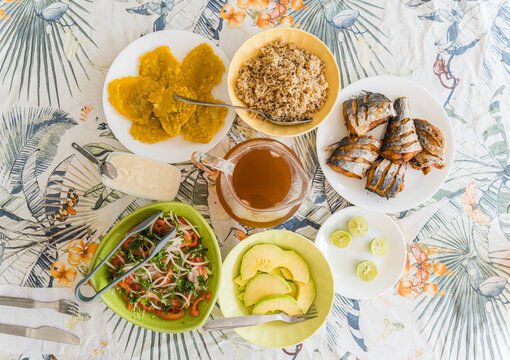 Caribbean tropical feast with fried fish and plantains