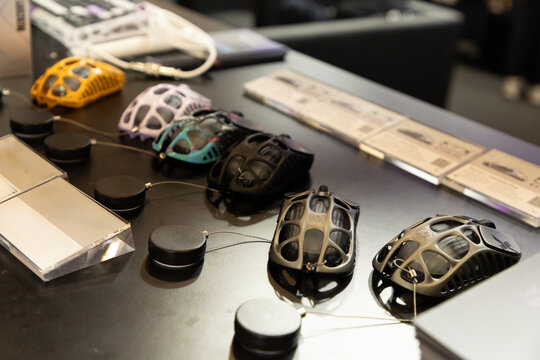 Colorful gaming mice displayed on sleek black table