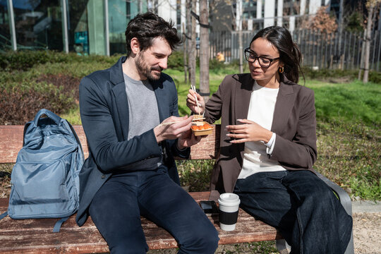 Business colleagues sharing lunch outdoors during a break