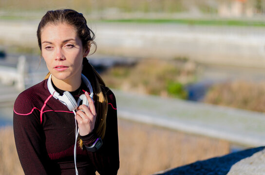 Woman resting after running in outdoor setting