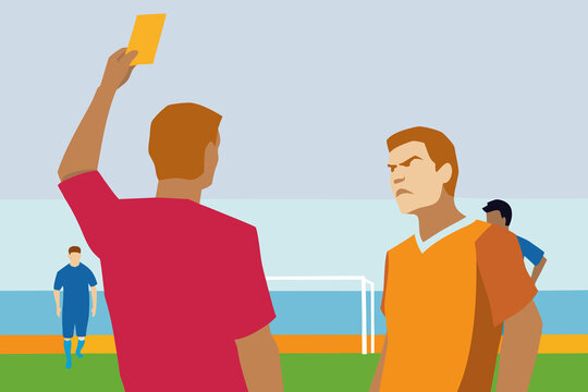 Soccer players during a match with a player receiving a yellow card