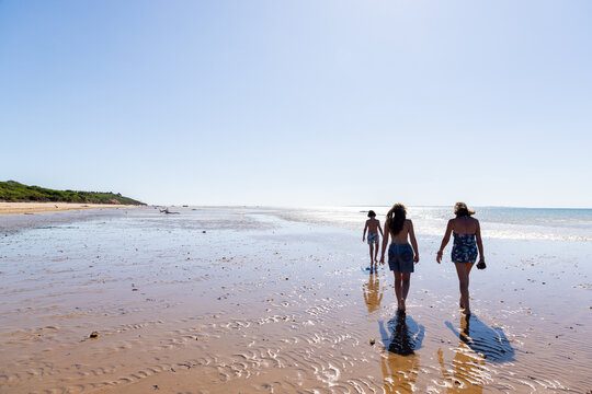 family walking beach, Vilankulos, Mozambique, Africa