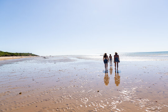 family walking beach, Vilankulos, Mozambique, Africa