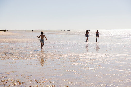 family walking beach, Vilankulos, Mozambique, Africa