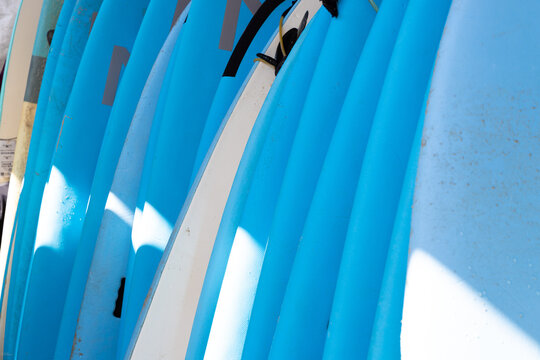 abstract of colorful surf boards stacked up