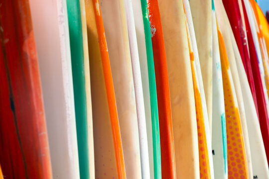abstract of colorful surf boards stacked up