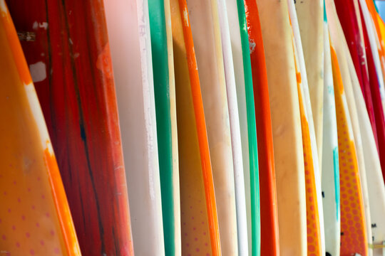 abstract of colorful surf boards stacked up
