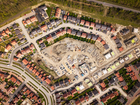 Aerial view directly above affordable new build housing construction site in the UK