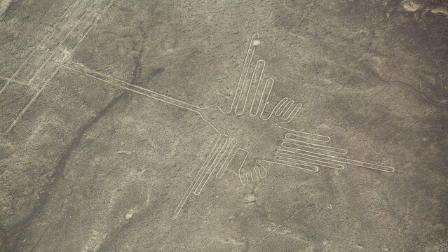  Aerial view of ancient Nazca Hummingbird geoglyph in Peru with copy space
