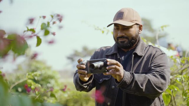 Man capturing photos on smartphone, testing camera quality while shooting photos and videos, casual hobby vibes, modern mobile photography in everyday life, hand closeup, capturing photos