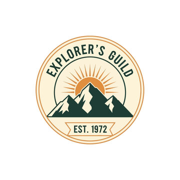 Vintage Explorers Guild Emblem with Mountains and Sun.