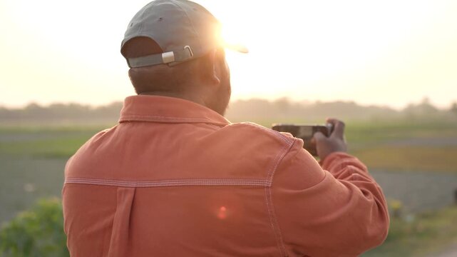 Man capturing photos on smartphone, testing camera quality while shooting photos and videos, casual hobby vibes, modern mobile photography in everyday life, hand closeup, capturing photos