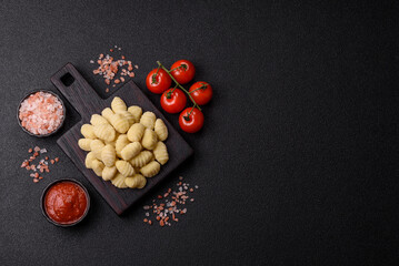 Raw homemade potato gnocchi, made with salt and spices, ready for lunch. Raw gnocchi