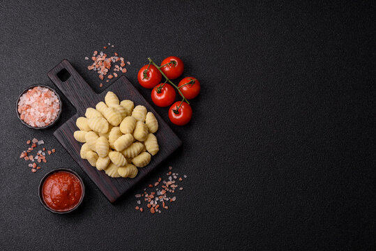 Raw homemade potato gnocchi, made with salt and spices, ready for lunch. Raw gnocchi