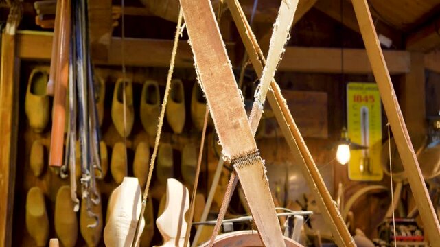 Clogs making. A clog maker also called wooden shoes in holland is engraving original dutch clogs, this craft can be seen at the cheese market