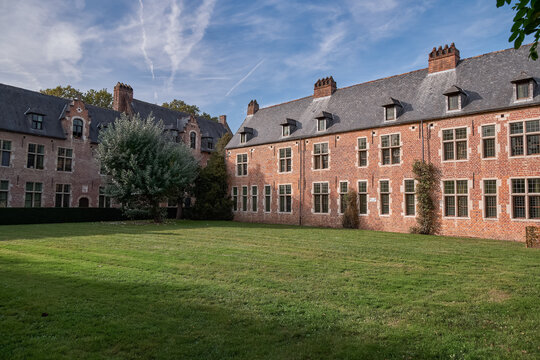 Quiet courtyard and brick facades in Groot Begijnhof - Leuven, Belgium