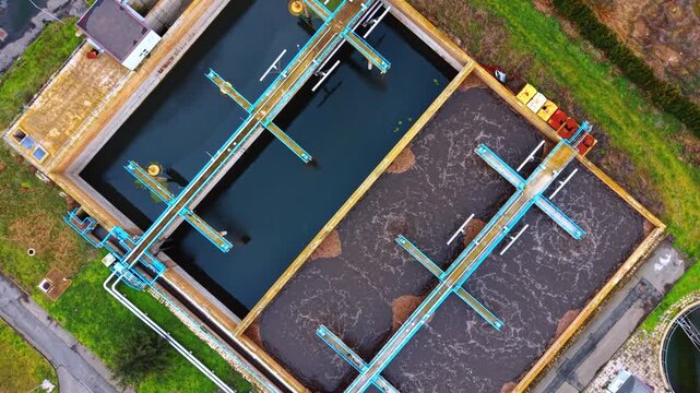 Water bubbles in one of the rectangular reservoirs with sewage inside. Recycling resources concept.