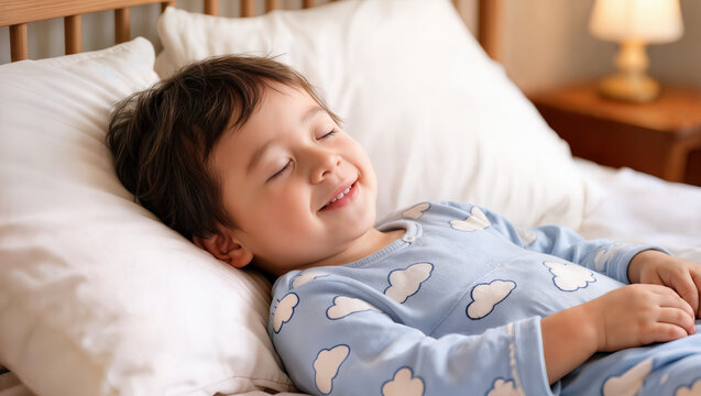 Child sleeping peacefully in cozy bed with soft pillows and warm lighting creating a serene atmosphere. This joyful child smiles in deep sleep surrounded by comfort and tranquility