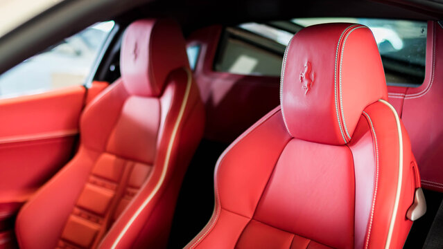 Ferrari 458 red leather driver seat close up, Exotic supercar luxury interior cabin