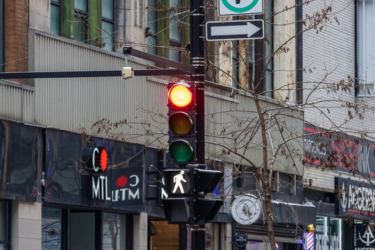Canada, Montreal, 23 December 2025 : Traffic light showing red signal for vehicles and pedestrians