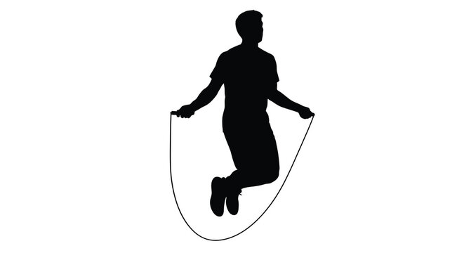 A person mid jump energetically skipping rope in a striking silhouette
