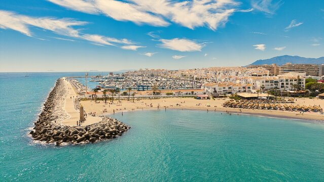 Puerto Ban&uacute;s marina aerial view, Marbella coastal harbor and beach, Costa del Sol, Spain drone panorama