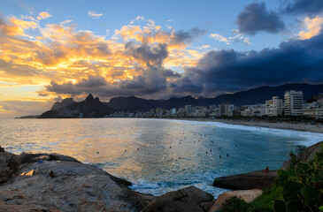 Sunset view of Ipanema beach and mountain Dois Irmao (Two Brother) in Rio de Janeiro, Brazil. Ipanema beach is the most famous beach of Rio de Janeiro, Brazil. Cityscape of Rio de Janeiro.