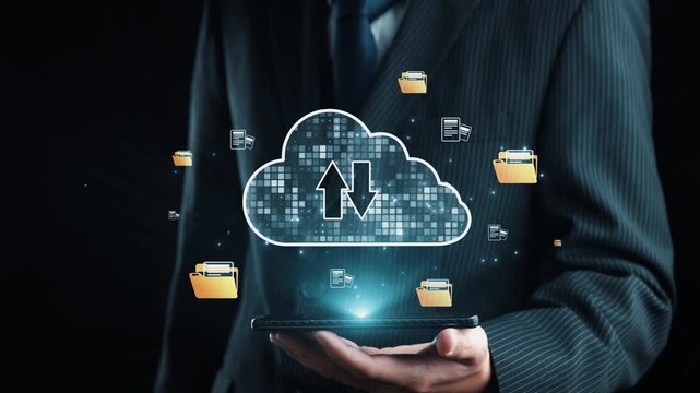 A professional businessman holds a tablet showcasing cloud computing visuals with symbols of file folders and data transfer, symbolizing modern business solutions and efficiency. Qubit